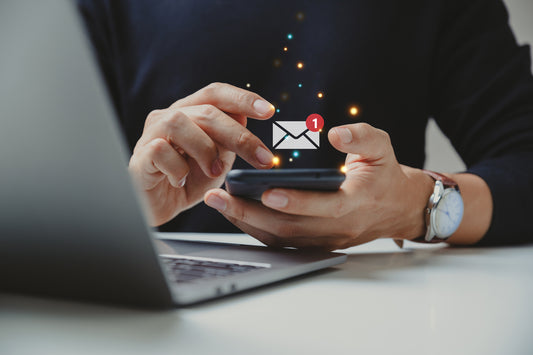 email icon and man holding a phone